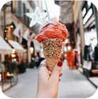 hand hold an ice-cream on city back view 